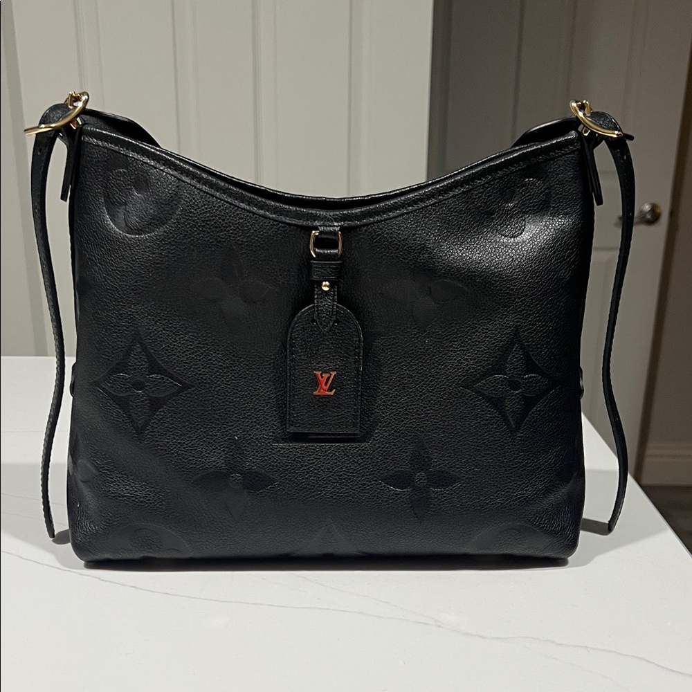Louis Vuitton Black Carry All PM empreinte, leather, black. New with receipt,